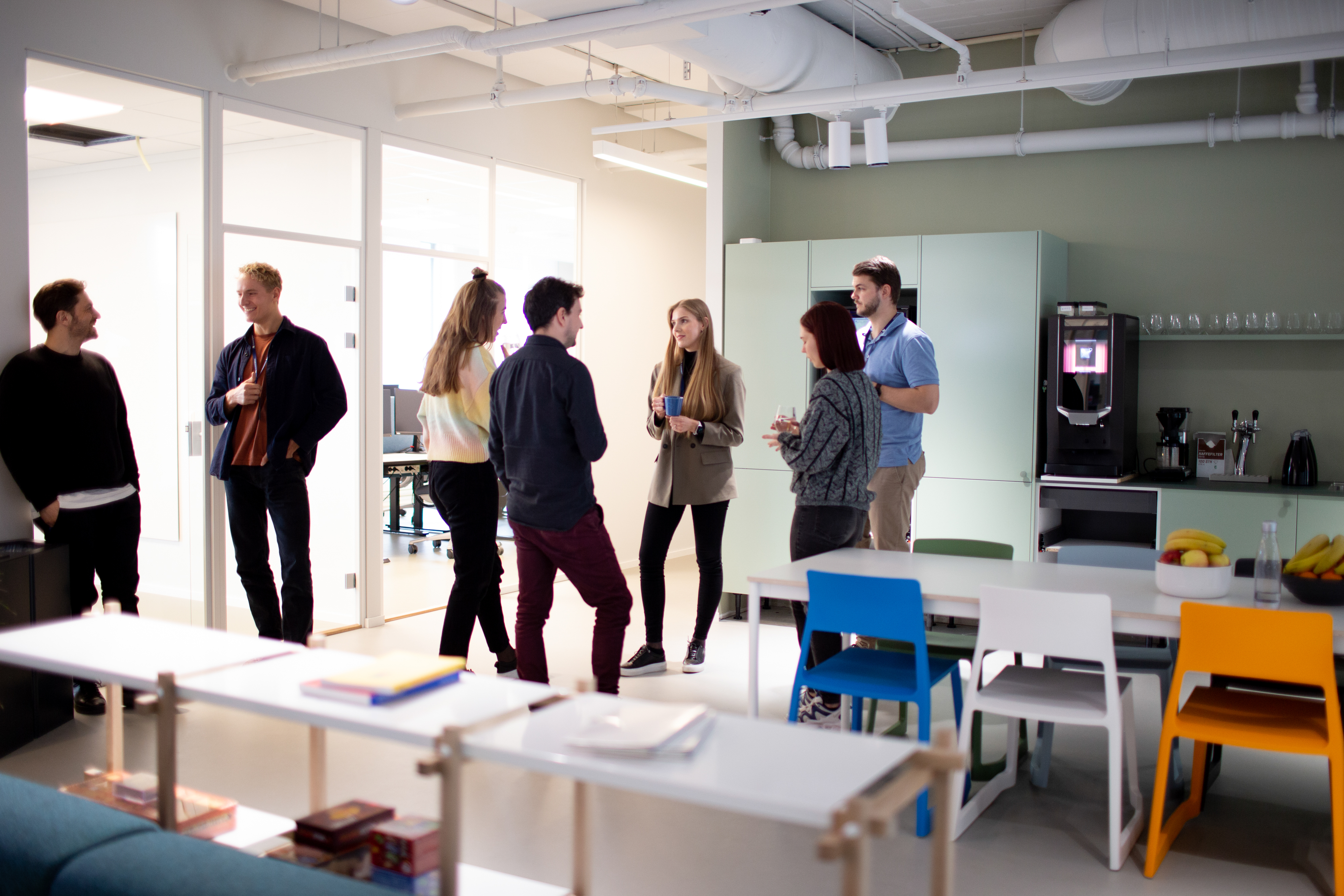 People talking in the kitchen area